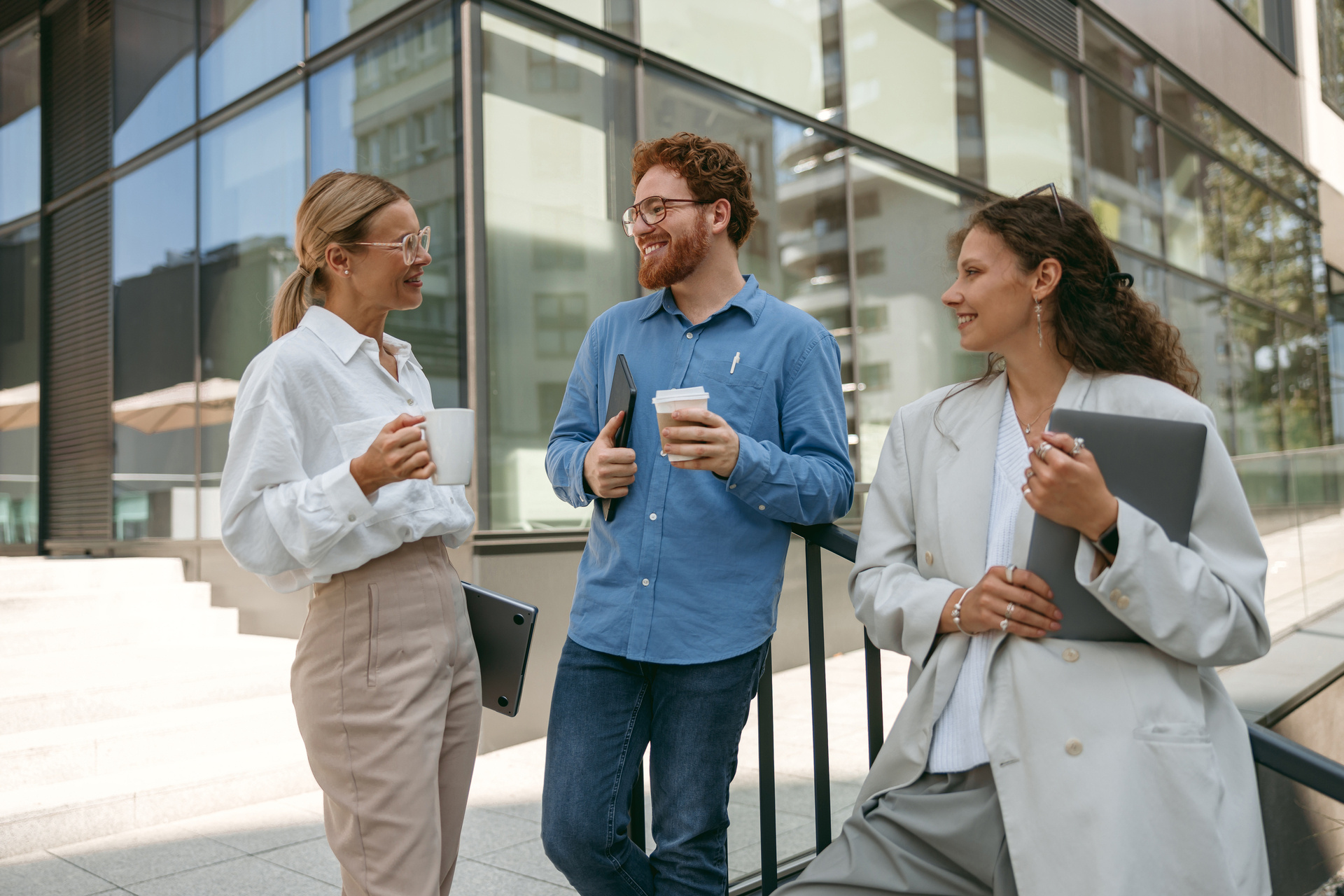 smiling-business-colleagues-talking-laughing-b